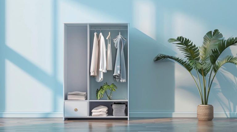 A white wardrobe filled with neatly hung clothes, showcasing a variety of colors and styles.