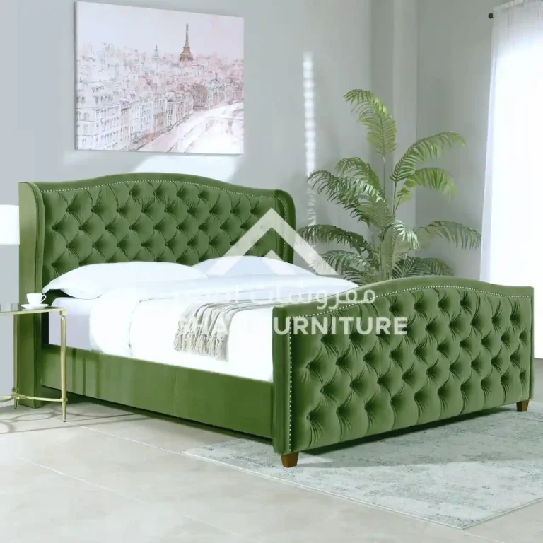 A beautifully made green velvet bed featuring a stylish buttoned headboard, adding elegance to the bedroom decor.