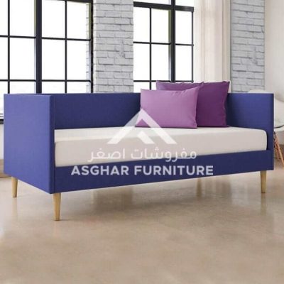 violet daybed with pillows placed in a living room