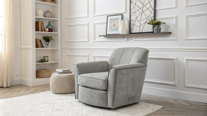 A gray recliner positioned in a bright room with white walls, creating a cozy and inviting atmosphere.